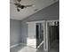 Inviting bedroom showcasing a modern sliding door leading to the en-suite bath and closet at 231 Old Mill Cir, Kissimmee, FL 34746
