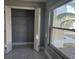 Bright bedroom featuring a closet, window view, and tile flooring at 231 Old Mill Cir, Kissimmee, FL 34746