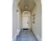 Covered front entryway with tiled floor and a white front door at 231 Old Mill Cir, Kissimmee, FL 34746