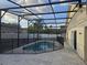 Private screened in pool with a safety fence, perfect for relaxing and enjoying the outdoors at 231 Old Mill Cir, Kissimmee, FL 34746