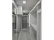 Spacious walk-in closet with custom shelving and drawers, providing ample storage and organization at 231 Old Mill Cir, Kissimmee, FL 34746
