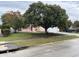 Single story home with a well manicured lawn and a two car garage at 2417 Lancashire Ln, Kissimmee, FL 34743