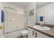 Tiled bathroom with glass enclosed shower, neutral walls, and sink vanity at 248 Breezy Oaks Ct, Davenport, FL 33896