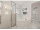 This bathroom features a separate glass enclosed shower and tub at 248 Breezy Oaks Ct, Davenport, FL 33896
