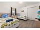 Comfortable bedroom with two twin beds, neutral walls, and a TV at 248 Breezy Oaks Ct, Davenport, FL 33896