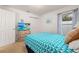 Comfortable bedroom featuring a queen bed, carpeted floors, and a closet at 248 Breezy Oaks Ct, Davenport, FL 33896