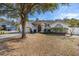Charming single-story home with an attached two-car garage and mature landscaping in a serene neighborhood at 248 Breezy Oaks Ct, Davenport, FL 33896