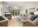 Living room with a view of the outdoor patio and sliding glass doors at 248 Breezy Oaks Ct, Davenport, FL 33896