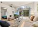 Comfortable living room with access to the patio offering natural light and outdoor views at 248 Breezy Oaks Ct, Davenport, FL 33896