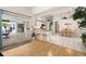 Spacious living area with views to the kitchen and dining spaces at 248 Breezy Oaks Ct, Davenport, FL 33896