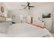 Comfortable bedroom with bright walls, carpet and a ceiling fan at 248 Breezy Oaks Ct, Davenport, FL 33896