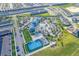 Aerial view of community pool, basketball court, clubhouse and surrounding neighborhood at 281 Jetty Way, Davenport, FL 33897