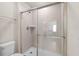 Shower with tiled walls and glass door at 281 Jetty Way, Davenport, FL 33897