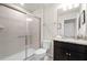 Bathroom with granite countertops, a glass shower, and neutral tile at 281 Jetty Way, Davenport, FL 33897