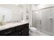 Modern bathroom with granite countertops and a glass-enclosed shower at 281 Jetty Way, Davenport, FL 33897