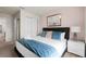 Inviting bedroom with soft, blue-toned pillows, a neutral painting, and a plush duvet at 281 Jetty Way, Davenport, FL 33897