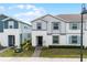 Charming two-story townhome with well-manicured landscaping and a welcoming front entrance at 281 Jetty Way, Davenport, FL 33897