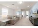 Cozy living room with a comfortable sofa, soft pillows, and modern decor at 281 Jetty Way, Davenport, FL 33897