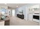 Open-concept living area with laundry closet, comfortable seating, and entertainment center at 281 Jetty Way, Davenport, FL 33897