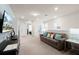 Cozy upstairs Gathering room with comfortable seating, a mounted TV, and neutral color palette at 281 Jetty Way, Davenport, FL 33897