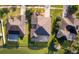 Aerial view of backyard with screened in pool and lake, surrounded by lush greenery and a well-maintained neighborhood at 2864 Lafayette Trace Dr, St Cloud, FL 34772
