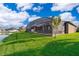 The backyard has a screened-in patio and lush green lawn that extends to the waterfront, offering a peaceful retreat at 2864 Lafayette Trace Dr, St Cloud, FL 34772