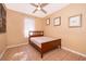 Cozy bedroom with tile flooring, neutral paint, a ceiling fan, and natural light from the window at 2864 Lafayette Trace Dr, St Cloud, FL 34772