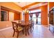 Elegant dining room featuring a chandelier, backyard access, and a classic wooden table at 2864 Lafayette Trace Dr, St Cloud, FL 34772