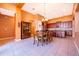 A spacious dining room features a wooden table set and seamless transition to kitchen at 2864 Lafayette Trace Dr, St Cloud, FL 34772