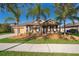 Charming single-story home featuring a two-car garage, well-maintained lawn, and a welcoming front porch at 2864 Lafayette Trace Dr, St Cloud, FL 34772