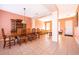 Open-concept living space with tile floors, seamlessly connecting the living and dining areas for flexible use at 2864 Lafayette Trace Dr, St Cloud, FL 34772