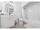 This bathroom features a modern vanity, an oval mirror, and a shower and tub combo at 3060 George Mason Ave # 12 D, Winter Park, FL 32792
