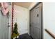 Inviting entryway with decorative accents and modern gray door at 3060 George Mason Ave # 12 D, Winter Park, FL 32792
