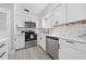 Well-equipped kitchen boasting stainless steel appliances and marble backsplash at 3060 George Mason Ave # 12 D, Winter Park, FL 32792