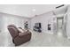 Bright living room featuring tile flooring and a sliding glass door at 3060 George Mason Ave # 12 D, Winter Park, FL 32792