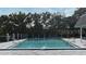 Community pool offers a refreshing escape, surrounded by lush greenery and shade at 3060 George Mason Ave # 12 D, Winter Park, FL 32792