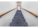 Carpeted staircase with wooden handrail leading to the upper level at 3060 George Mason Ave # 12 D, Winter Park, FL 32792