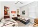 Shared bedroom features two beds with decorative quilts, and a bright window with blinds at 309 Vestrella Dr, Poinciana, FL 34759