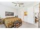 Cozy bedroom with neutral walls, ceiling fan, and convenient access to other rooms at 309 Vestrella Dr, Poinciana, FL 34759