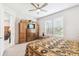 Inviting bedroom features large window and ample storage with a built-in wardrobe at 309 Vestrella Dr, Poinciana, FL 34759