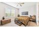 Inviting bedroom with neutral walls, ceiling fan, and a cozy decor, creating a relaxing retreat at 309 Vestrella Dr, Poinciana, FL 34759