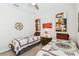 Shared bedroom with matching beds, decorative quilts, and eclectic wall art at 309 Vestrella Dr, Poinciana, FL 34759