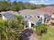 Beautiful home with mature landscaping and a welcoming brick driveway at 309 Vestrella Dr, Poinciana, FL 34759