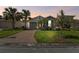 Inviting home with lush landscaping, brick driveway, and beautiful curb appeal at 309 Vestrella Dr, Poinciana, FL 34759