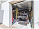 View of garage showing a golf cart and storage shelves, maximizing space for vehicles and organization at 309 Vestrella Dr, Poinciana, FL 34759