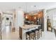 Stylish kitchen with a central island, granite countertops, breakfast bar, and stainless steel appliances for modern living at 309 Vestrella Dr, Poinciana, FL 34759