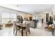 Bright living room featuring tile flooring, ample seating, and access to the lanai at 309 Vestrella Dr, Poinciana, FL 34759