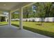 Back porch with a view of the backyard and white fence at 3725 Deer Ridge Dr, Mount Dora, FL 32757
