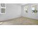 Bright, blank canvas bedroom with wood look tile flooring and natural light from double window at 3725 Deer Ridge Dr, Mount Dora, FL 32757