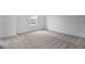 Bright bedroom featuring gray carpet and a large window at 3725 Deer Ridge Dr, Mount Dora, FL 32757